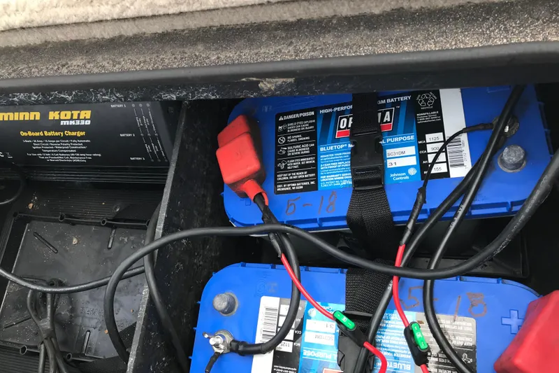 Slide: The Image of 2001 Ranger 518DVX Comanche boat battery setup with Minn Kota onboard charger. - 26