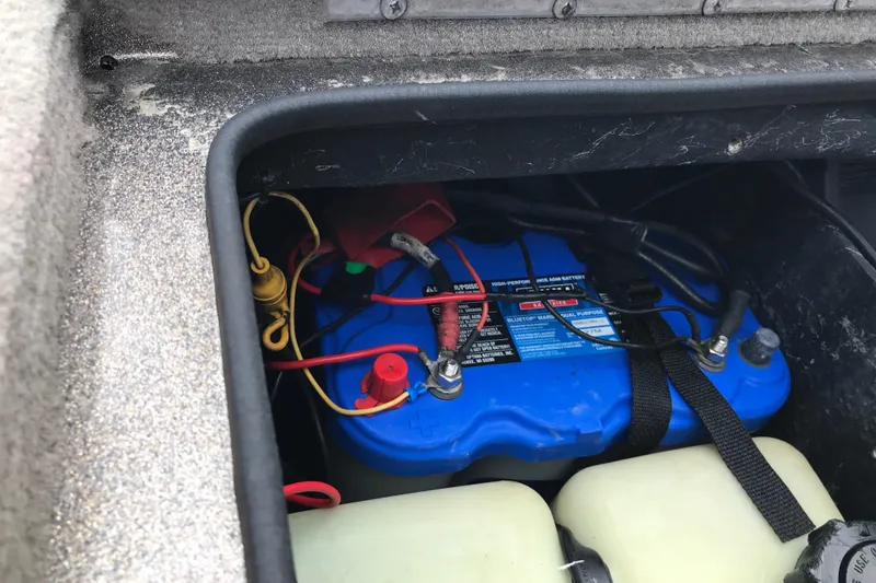 Slide: The Image of Battery compartment of a 2001 Ranger 518DVX Comanche boat with visible wiring connections. - 29