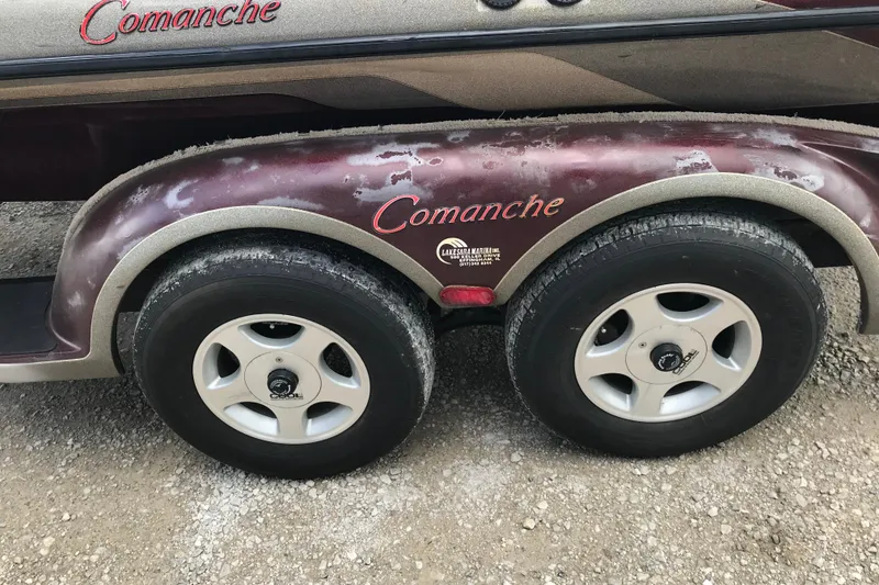 Slide: The Image of 2001 Ranger 518DVX Comanche trailer with dual wheels on gravel surface. - 39