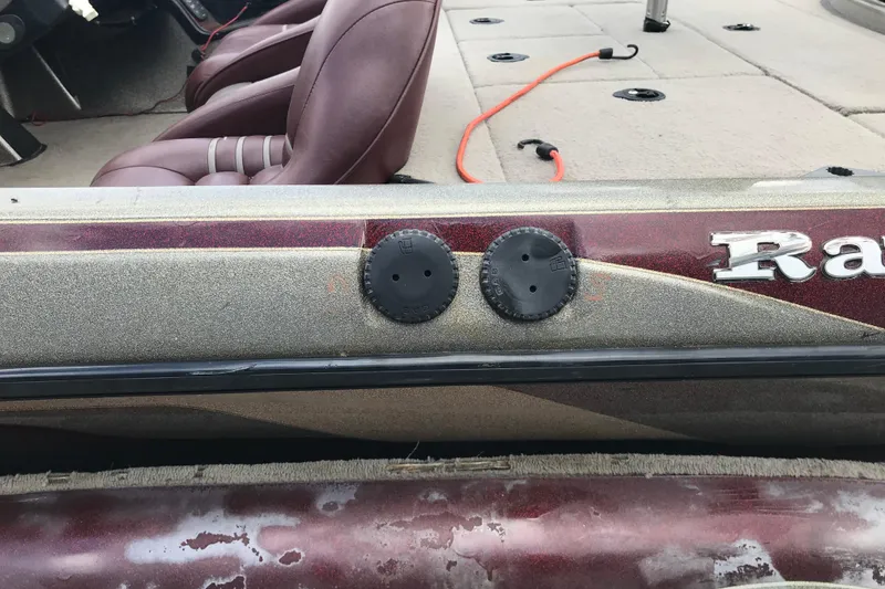 Slide: The Image of 2001 Ranger 518DVX Comanche boat interior with maroon seats and deck details. - 40