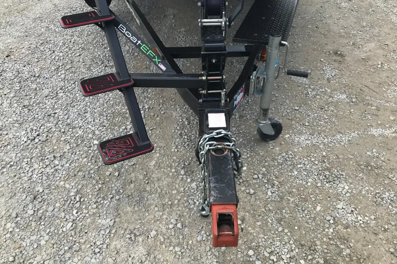 Slide: The Image of Trailer hitch of a 2001 Ranger 518DVX Comanche boat on gravel surface. - 45