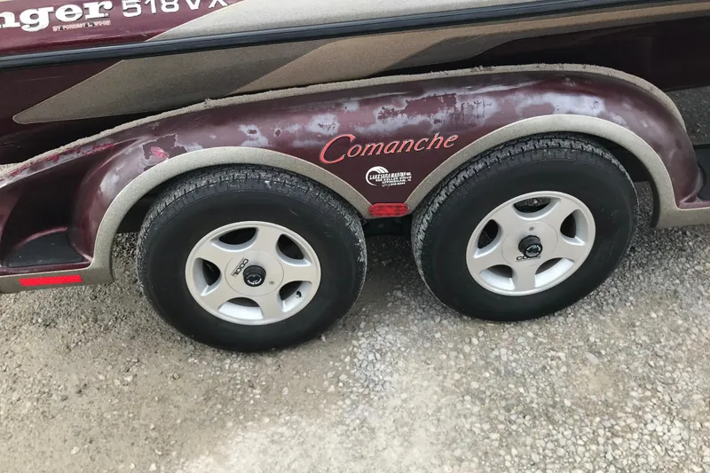 Slide: The Image of 2001 Ranger 518DVX Comanche trailer with dual wheels on gravel surface. - 47