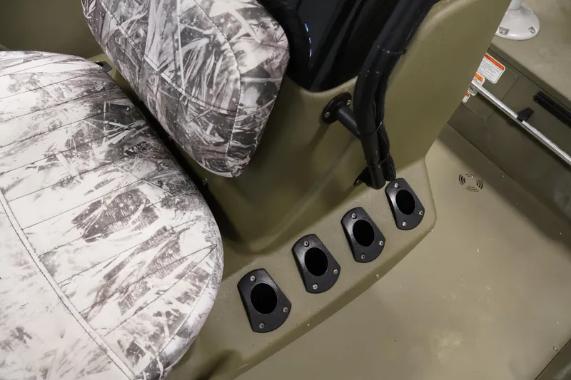 Slide: The Image of 2023 Tracker Grizzly 1860 MVX CC boat interior with camo seat and rod holders. - 20