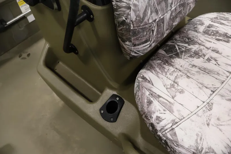 Slide: The Image of 2023 Tracker Grizzly 1860 MVX CC boat seats with camouflage pattern and cup holder. - 21