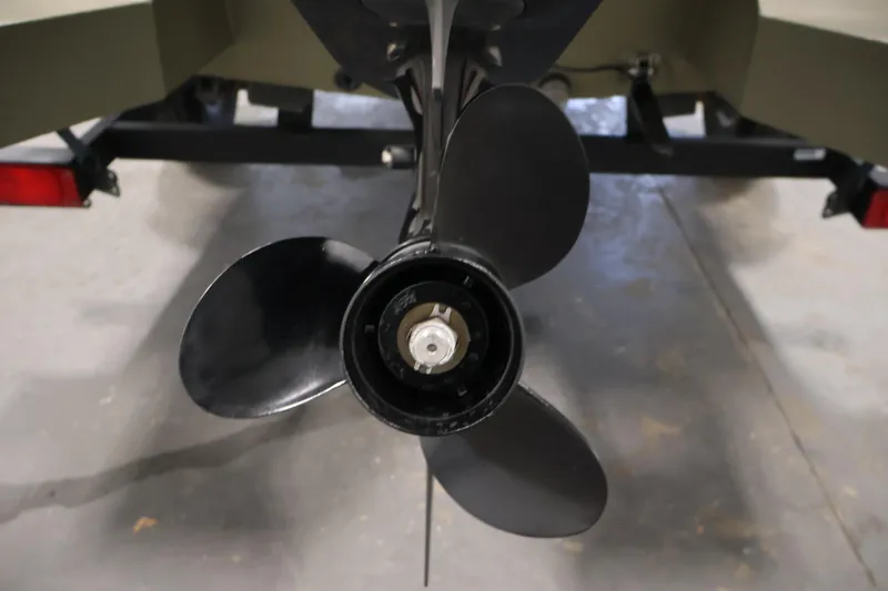 Slide: The Image of Propeller of 2023 Tracker Grizzly 1860 MVX CC boat on trailer. - 36