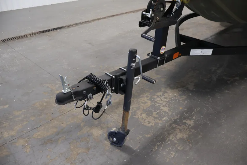 Slide: The Image of Trailer hitch of 2023 Tracker Grizzly 1860 MVX CC on concrete floor. - 37