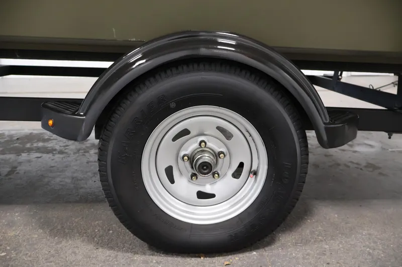 Slide: The Image of Trailer wheel of 2023 Tracker Grizzly 1860 MVX CC, featuring Karrier tire and metal rim. - 39