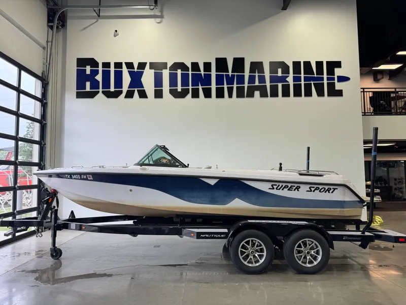 The Image of 2000 Nautique Super Sport 210 boat at Buxton Marine. - 1