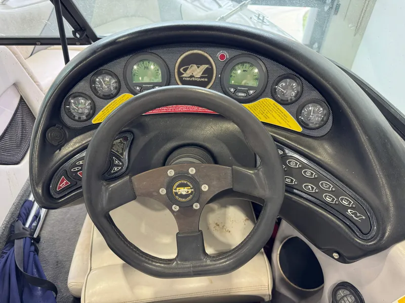 Slide: The Image of Dashboard of a 2000 Nautique Super Sport 210 boat. - 10