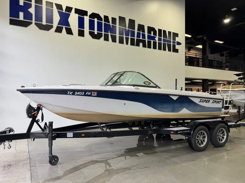 Slide: The Image of 2000 Nautique Super Sport 210 boat on trailer at Buxton Marine. - 3