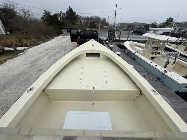 Slide: The Image of Roth Bilt 18 boat from 2022 on trailer at dock. - 12