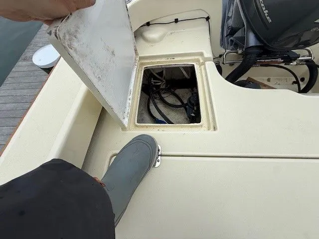 Slide: The Image of Roth Bilt 18 boat 2022 with open storage hatch. - 14