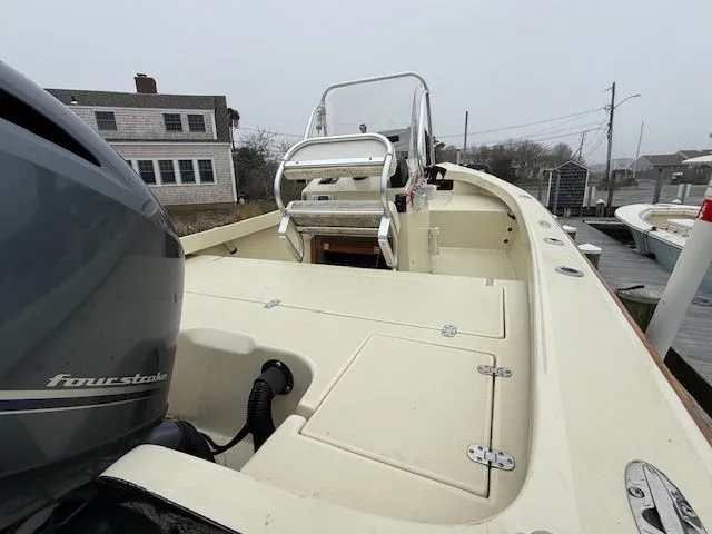 Slide: The Image of 2022 Roth Bilt 18 boat at dock, featuring outboard motor. - 5