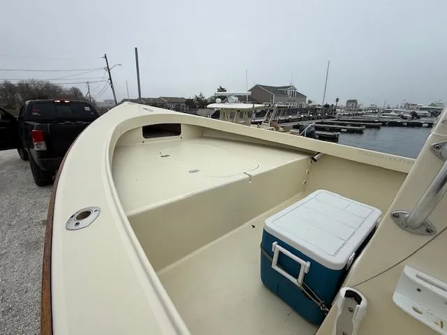 Slide: The Image of 2022 Roth Bilt 18 boat at dock with cooler. - 7