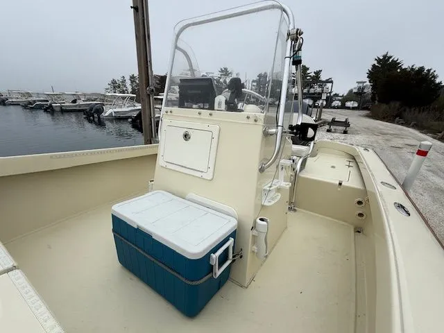Slide: The Image of Roth Bilt 18 boat 2022 at dock with cooler. - 8