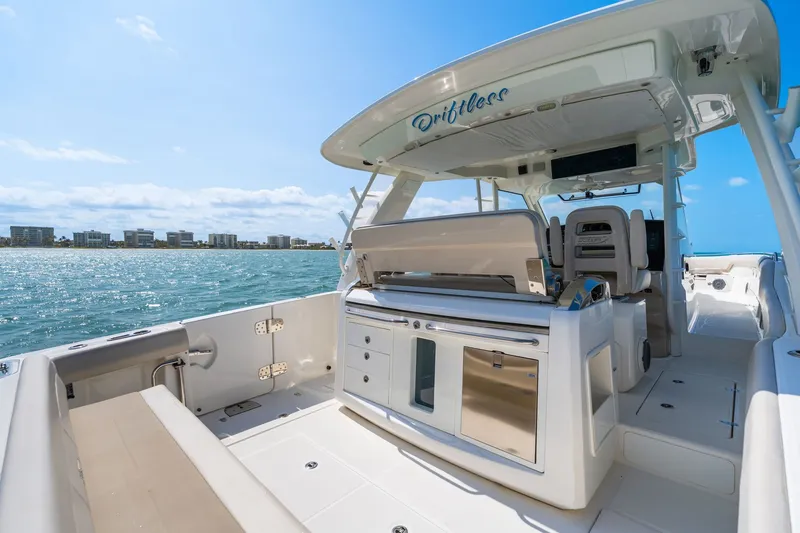 Slide: The Image of 2018 Boston Whaler 420 Outrage on open sea with clear view. - 17