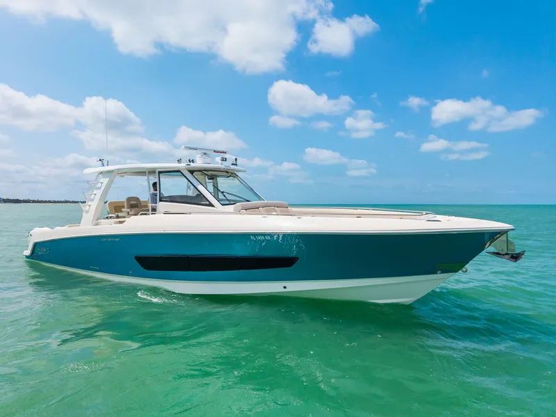 Slide: The Image of 2018 Boston Whaler 420 Outrage on calm sea under clear sky. - 3