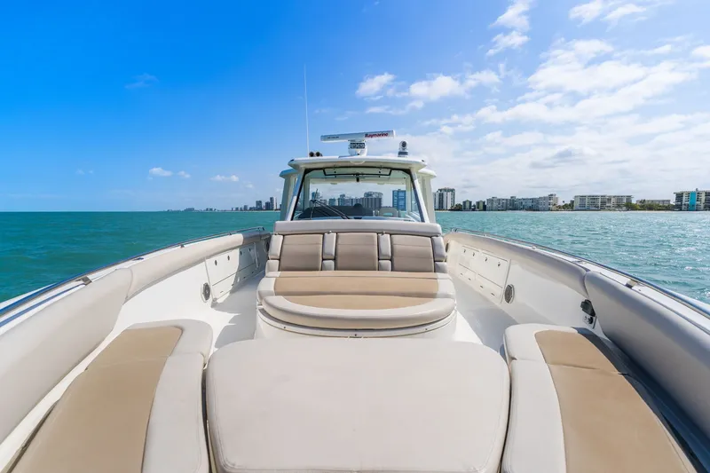 Slide: The Image of Boston Whaler 420 Outrage 2018 on open sea with city skyline. - 39