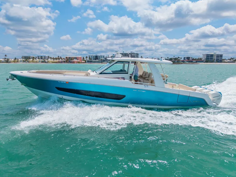 Slide: The Image of 2018 Boston Whaler 420 Outrage cruising on water, sunny day. - 42