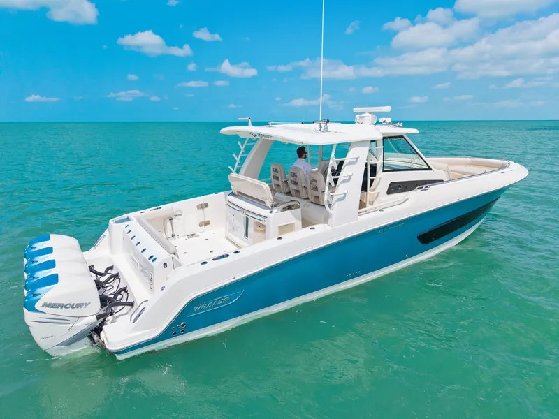 Slide: The Image of 2018 Boston Whaler 420 Outrage on open sea, blue waters. - 6