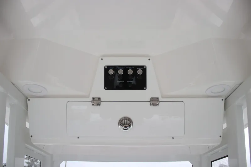 Slide: The Image of 2026 Sea Fox 228 Commander boat console with control panel and storage compartment. - 10