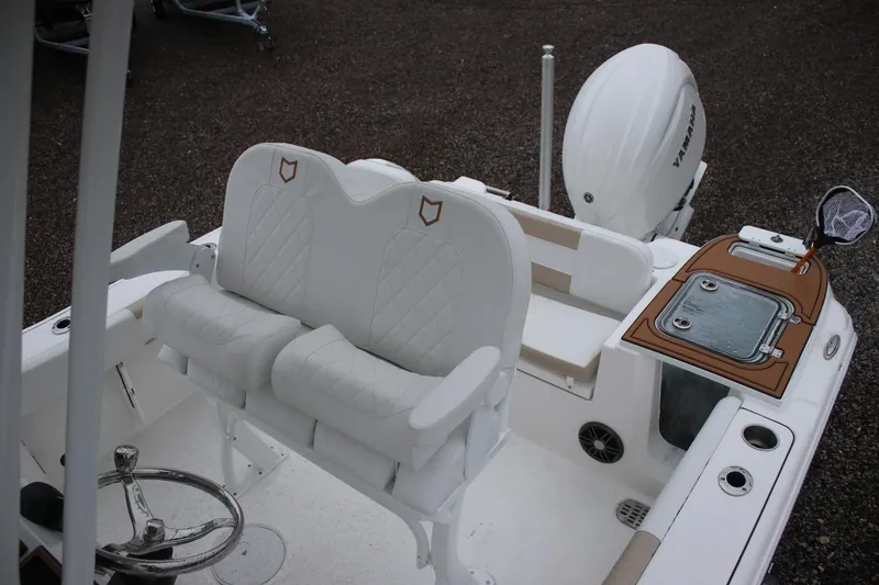 Slide: The Image of 2026 Sea Fox 228 Commander boat interior with white seating and Yamaha engine. - 14