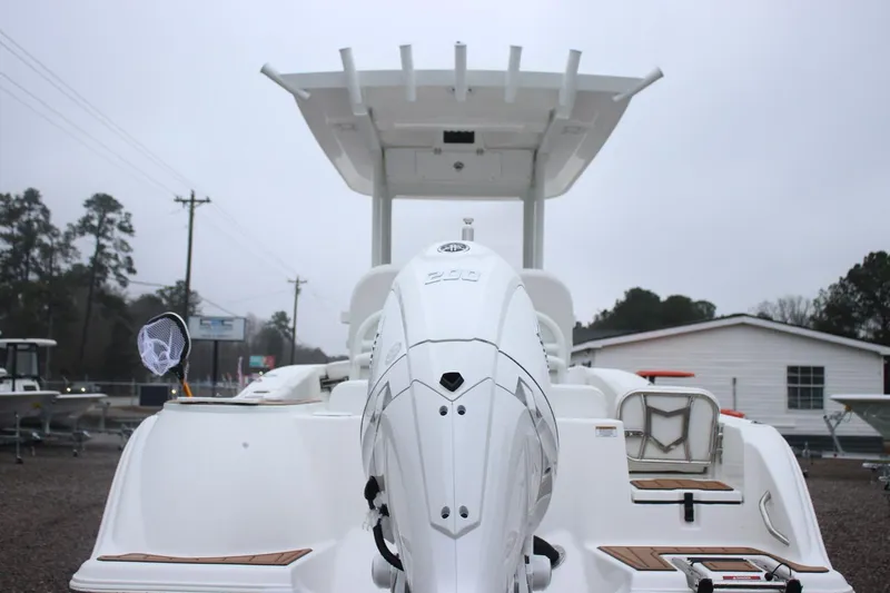Slide: The Image of 2026 Sea Fox 228 Commander boat with powerful outboard motor, docked outdoors. - 15