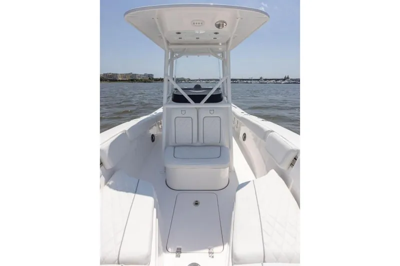 Slide: The Image of Manufacturer Provided Image: 2025 Sea Fox 228 Commander boat interior with seating and console on open water. - 25