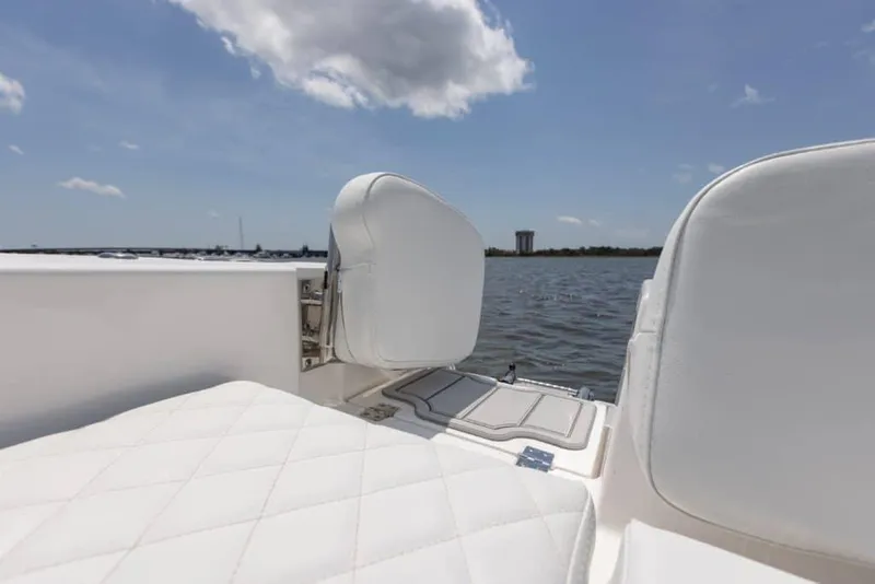 Slide: The Image of Manufacturer Provided Image: 2025 Sea Fox 228 Commander boat interior with white seating, overlooking calm waters. - 30