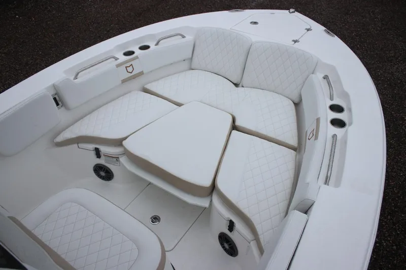 Slide: The Image of 2026 Sea Fox 228 Commander boat interior with cushioned seating and cup holders. - 34