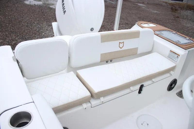 Slide: The Image of 2026 Sea Fox 228 Commander boat seating area with white and beige cushions. - 6