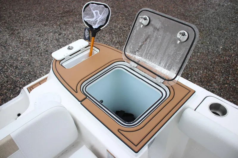 Slide: The Image of Open storage compartment on 2026 Sea Fox 228 Commander boat with fishing net. - 7