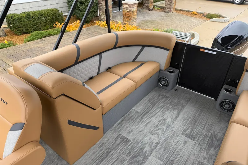 Slide: The Image of Luxurious interior of 2025 Crest Classic 220 pontoon boat with tan seating and modern flooring. - 11