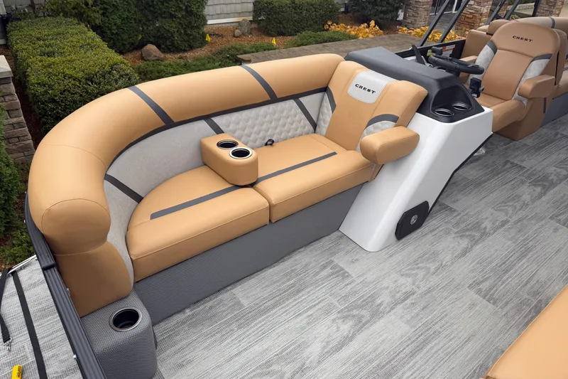 Slide: The Image of 2025 Crest Classic 220 boat interior with tan seating and modern design. - 4