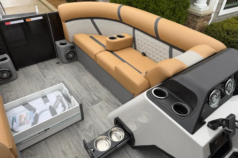 Slide: The Image of Interior of 2025 Crest Classic 220 boat with tan seating and modern amenities. - 8