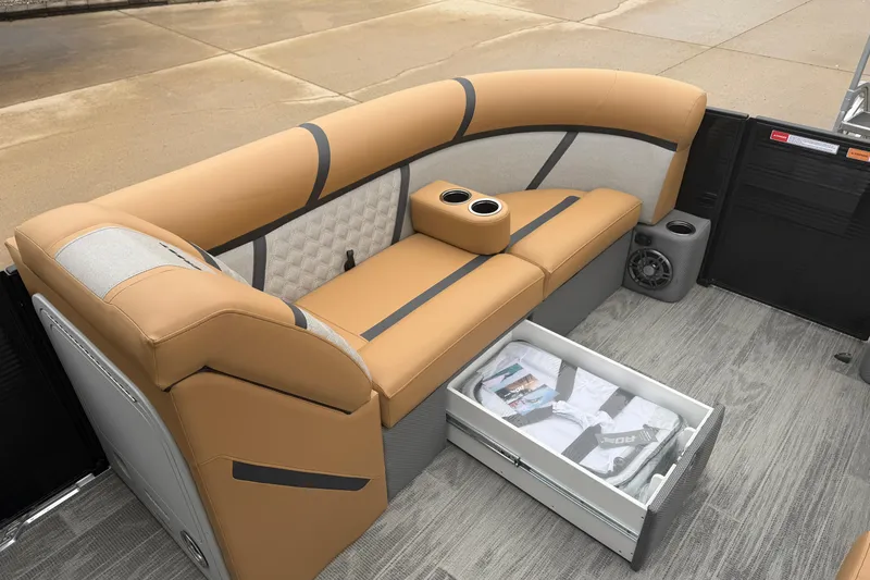 Slide: The Image of Luxurious seating on 2025 Crest Classic 220 boat with storage and cup holders. - 9