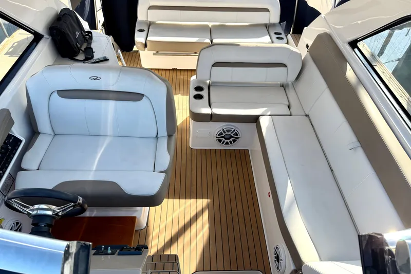 Slide: The Image of Interior of a 2017 Regal 35 Sport Coupe with luxurious seating and wood flooring. - 28