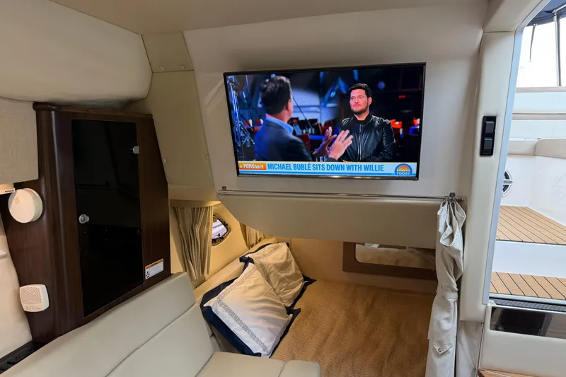 Slide: The Image of Interior of 2017 Regal 35 Sport Coupe with TV showing an interview scene. - 31