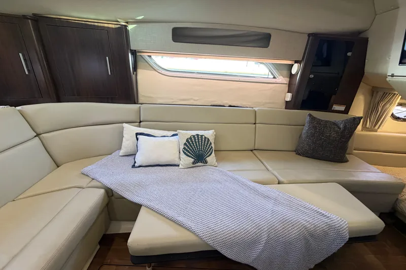 Slide: The Image of Luxurious interior of 2017 Regal 35 Sport Coupe with beige seating and decorative pillows. - 33