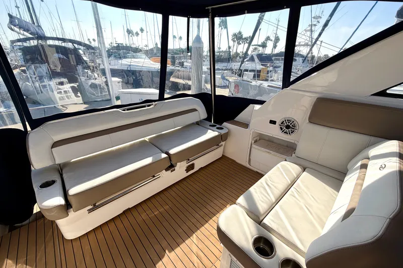 Slide: The Image of Interior of 2017 Regal 35 Sport Coupe yacht with luxurious seating and wood flooring. - 35