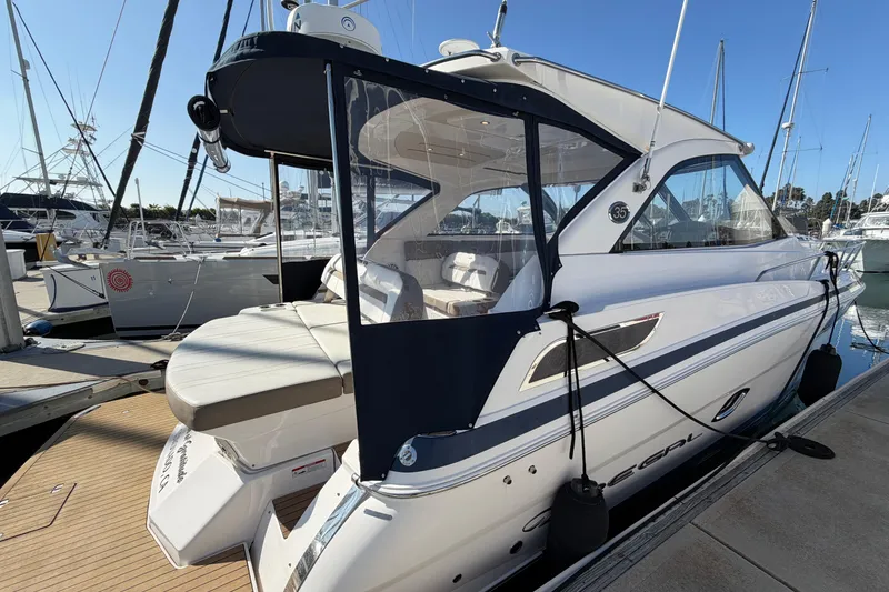Slide: The Image of 2017 Regal 35 Sport Coupe yacht docked at marina, showcasing sleek design and luxury features. - 45