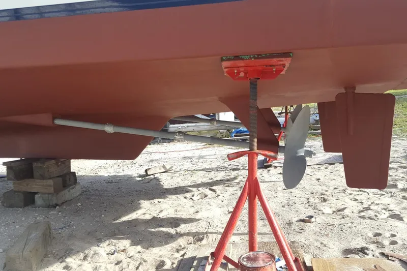 Slide: The Image of Bottom view of 1988 Overseas Monk 42 boat with propeller and rudder on stands. - 109