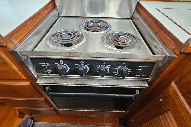 Slide: The Image of Vintage stove and oven in 1988 Overseas Monk 42 boat kitchen. - 40