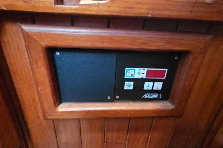 Slide: The Image of Control panel on 1988 Overseas Monk 42 boat, set in wooden frame. - 64