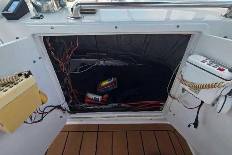 Slide: The Image of Open electrical panel on 1988 Overseas Monk 42 boat, showing wiring and components. - 20