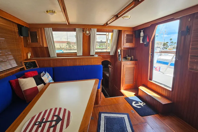 Slide: The Image of Interior of 1988 Overseas Monk 42 yacht with wooden decor and nautical accents. - 27