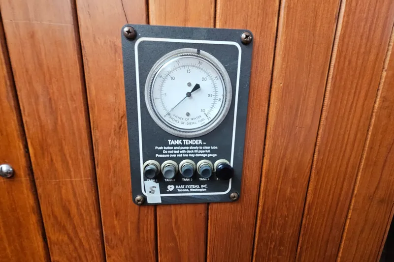 Slide: The Image of Tank tender gauge on wooden panel of 1988 Overseas Monk 42 boat. - 47
