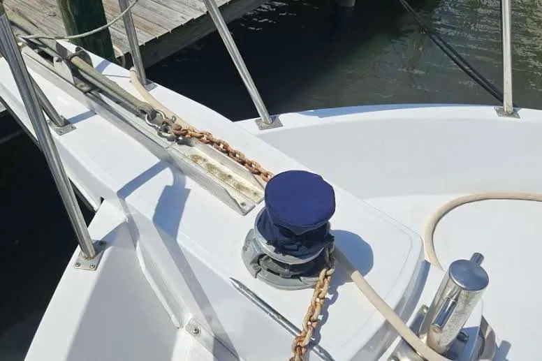 Slide: The Image of Deck of 1988 Overseas Monk 42 yacht with anchor chain and winch. - 99