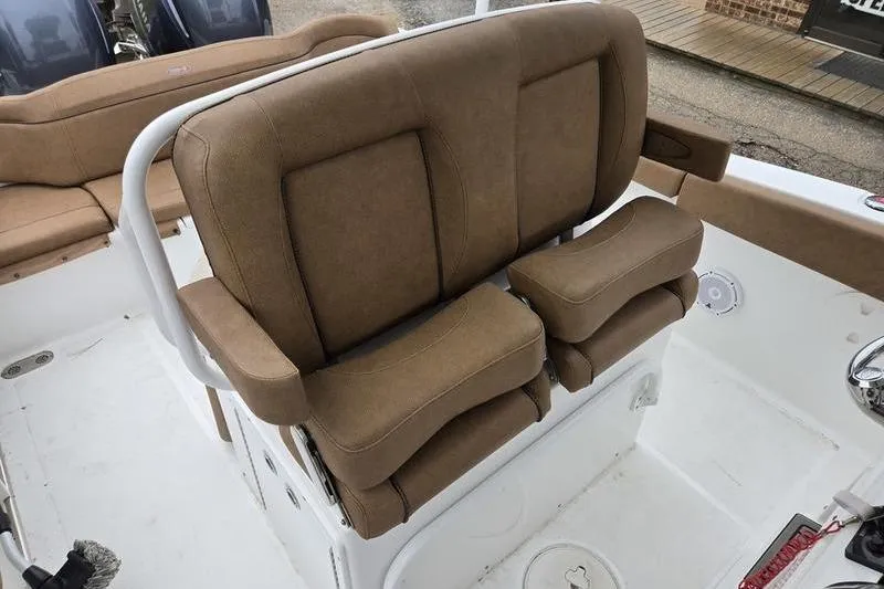 Slide: The Image of Brown cushioned seating on 2026 Sea Hunt Ultra 265 SE boat deck. - 17