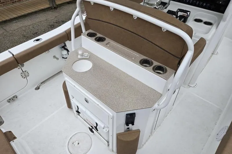 Slide: The Image of Interior of 2026 Sea Hunt Ultra 265 SE boat with seating and storage. - 8